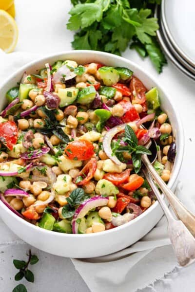 bowl of colorful chickpea and vegetable salad with dijon dressing
