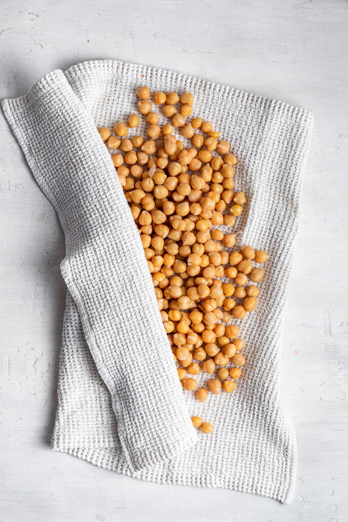 Chickpeas in.a towel getting dried off