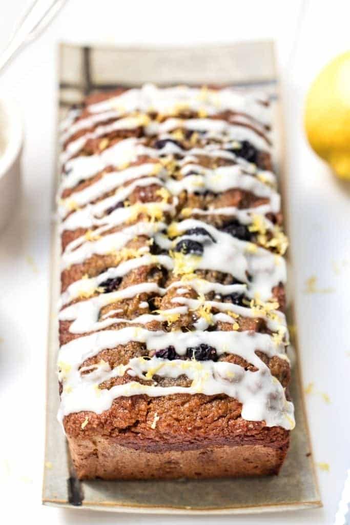 Whole loaf of healthy blueberry banana bread with coconut butter glaze