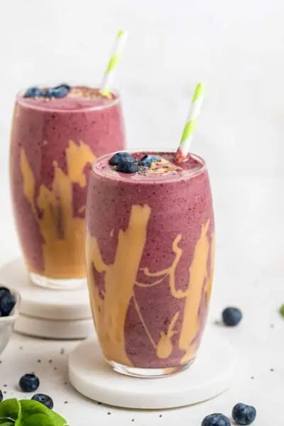 two glasses of peanut butter and jelly smoothies
