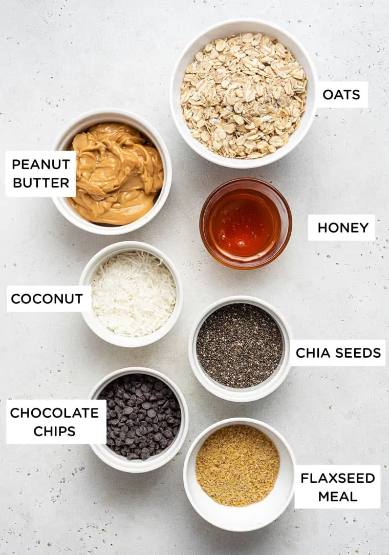 ingredients for energy bites with peanut butter, oats, coconut and chocolate